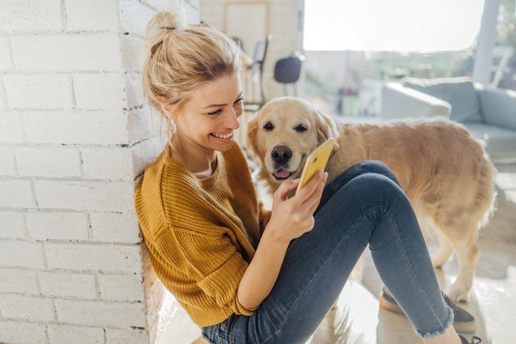 Lady with dog on phone